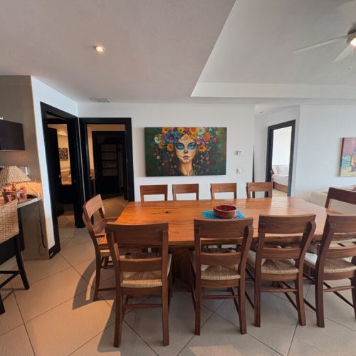 Dining Room table and entrance to Main Bedroom and ensuite bathroom