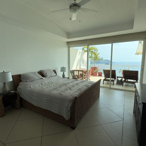 2nd Bedroom with Queen sized bed and side tables.