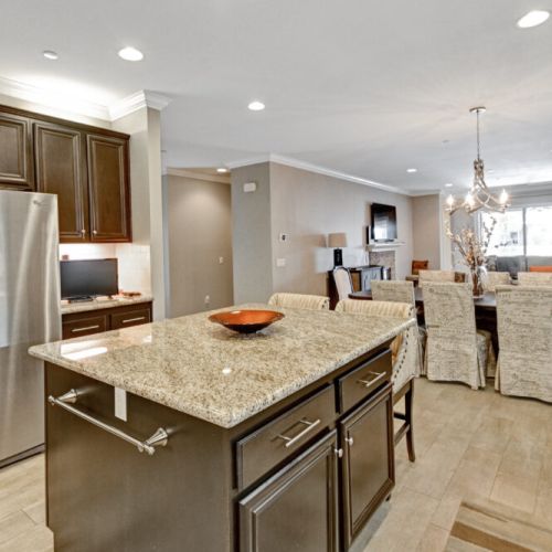 Kitchen & Island, Dining Area and Entrance to Back Patio