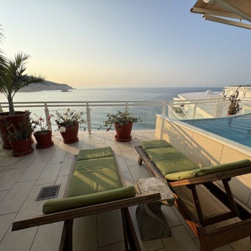 Lounge chairs on Patio by private pool
