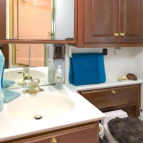 Bathroom Sink, Cabinets and Toilet