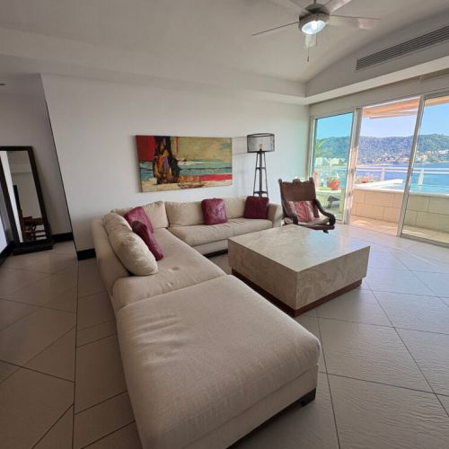 Living room seating with entrance to bedroom, and to the patio