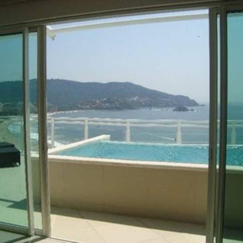 View from Living room, out onto Patio and private pool