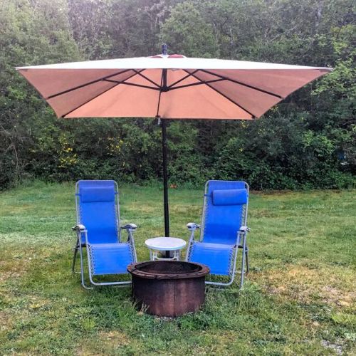 The outside wood Fire Pit lounging area