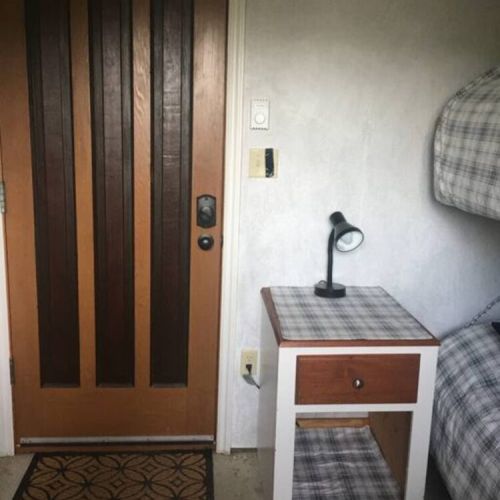 Bunkhouse entrance, side table and beds